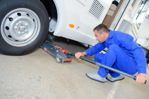 A technician servicing a caravan.