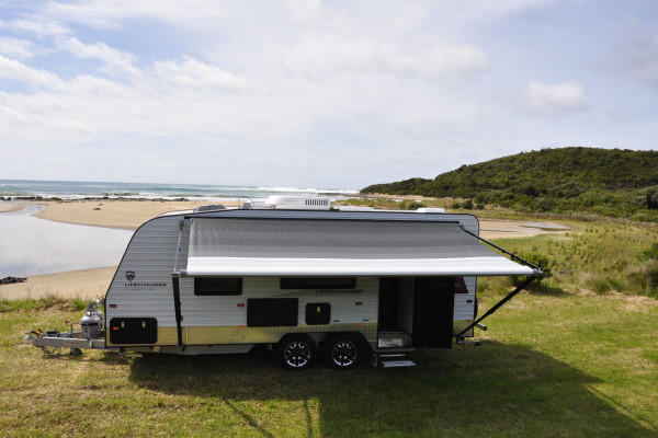 A caravan campsite near a river