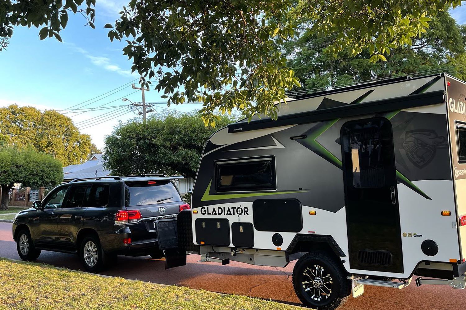 A car towing a caravan that's about to drive from Perth to Esperance.